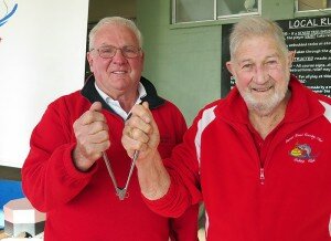 Long-standing Patron, Don Burns hands his beloved tongs over to incoming Patron, David Greenhalgh.